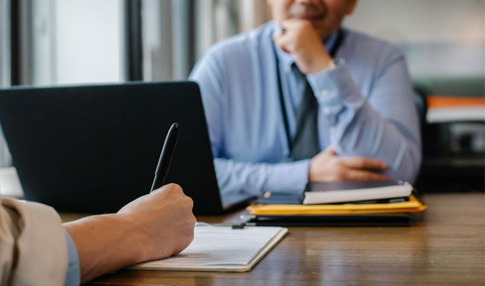 man working on worksheet