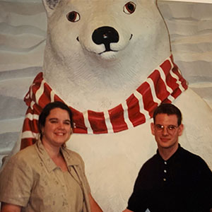 Shelly Hart and her husband in front of large polar bear