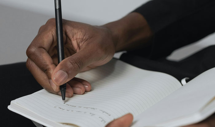 man working on worksheet